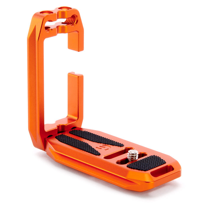 Orange metal clamp with black rubber pads on a white background