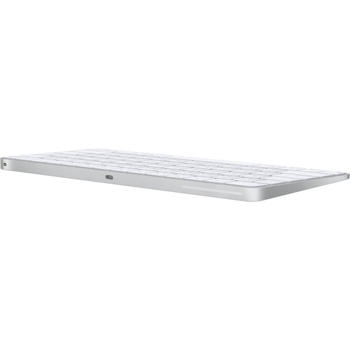 A sleek, low-profile Apple Magic Keyboard with a premium silver aluminum finish and minimalist white keys.