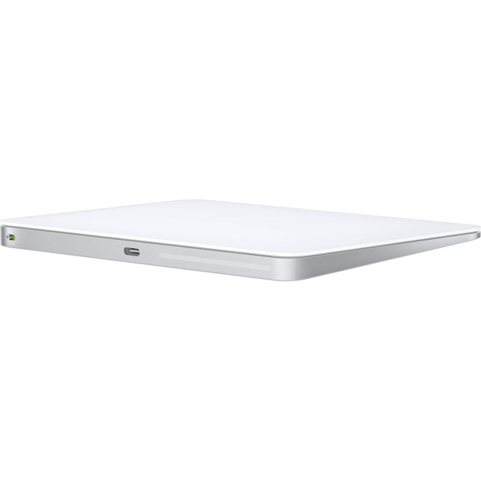 Apple Magic Trackpad in white with a smooth glass finish and USB-C charging port