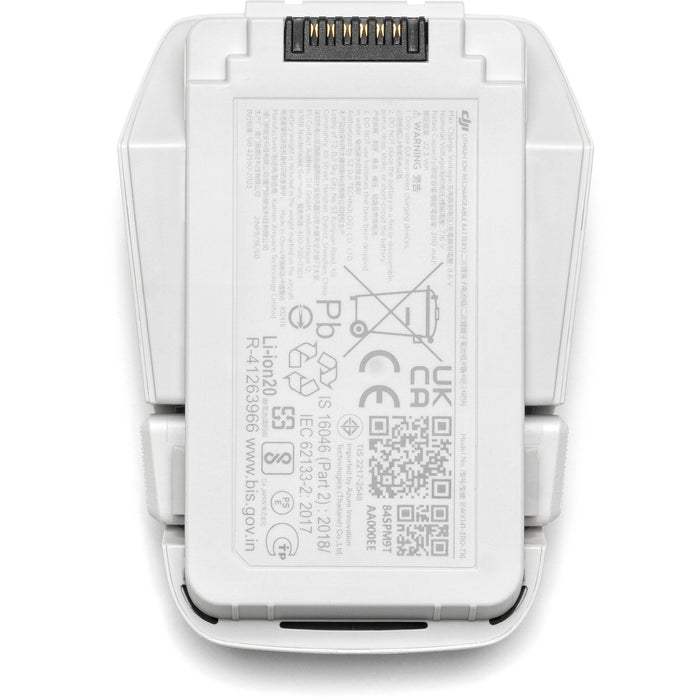 A black DJI Intelligent Flight Battery is shown, featuring a power button and four LED indicators.