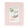 Pink photo album with a window displaying an Instax camera and van design on a white background