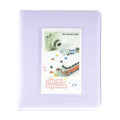Purple photo album with a front cover featuring a camera and car illustration, labeled 'colorful daydream'.
