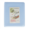 Light blue case for Instax Mini with colorful daydream design on a white background