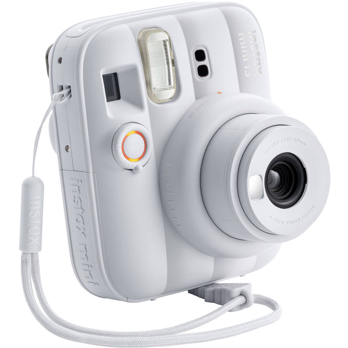 Focused front shot of White Instax 13 with wrist strap