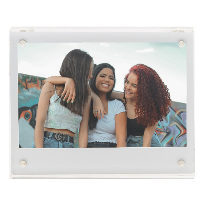 Fujifilm Instax Wide Acrylic Magnetic Frame – clear two-piece acrylic holder with four corner magnets, displaying a wide-format instant photograph and designed for easy sliding insertion on magnetic surfaces.