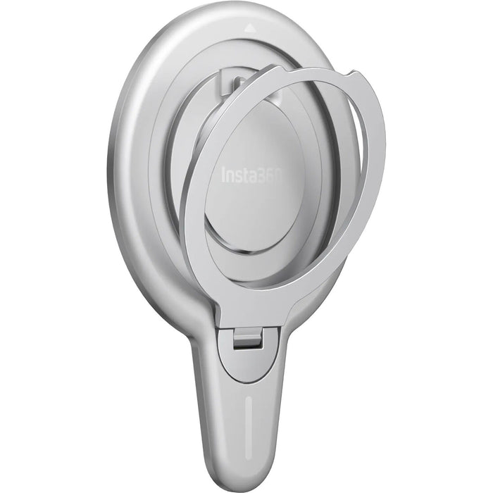 Insta360 Flow 2 Pro Magnetic Phone Mount with strong N52-grade magnets designed to securely hold MagSafe-compatible iPhone 12 or later models, featuring a 360° rotatable metal ring stand that doubles as a desktop phone stand, lightweight aluminum and silicone build, and compact 8.1 x 5.6 x 0.5 cm size.