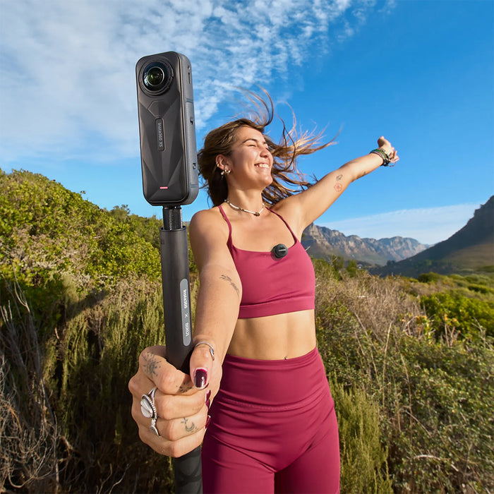 Compact Insta360 Mic Air wireless microphone transmitter weighing 7.9g with 48kHz/24-bit audio, noise reduction, magnetic clip, 10-hour battery life, and 300m wireless range for Insta360 X5 and Ace Pro 2 cameras.