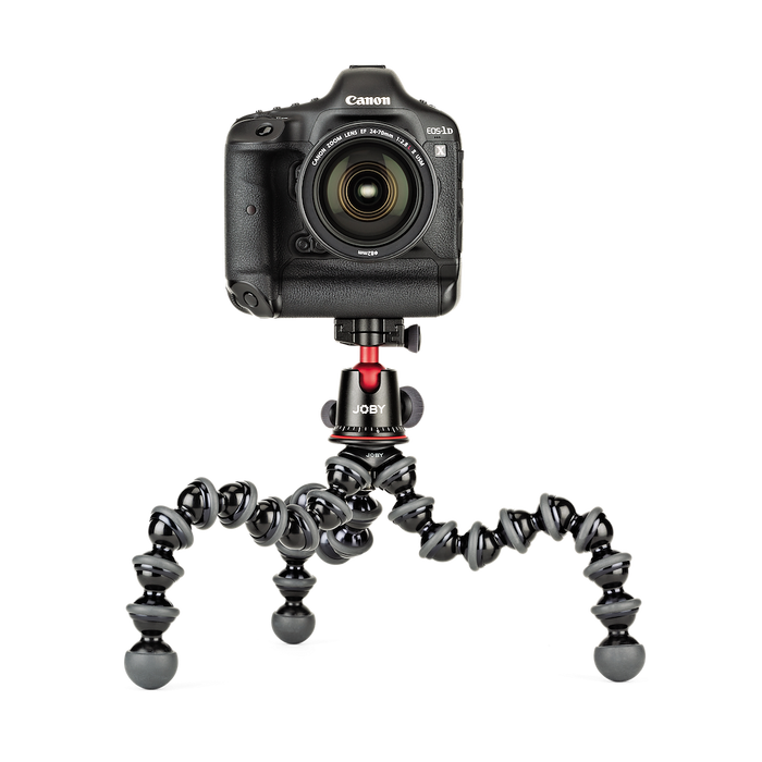 Canon camera mounted on a Joby gorilla pod stand on a white background