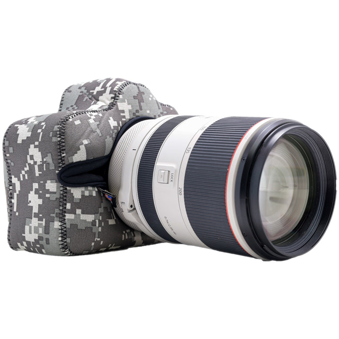 Camera with a lens and camouflage case on a white background
