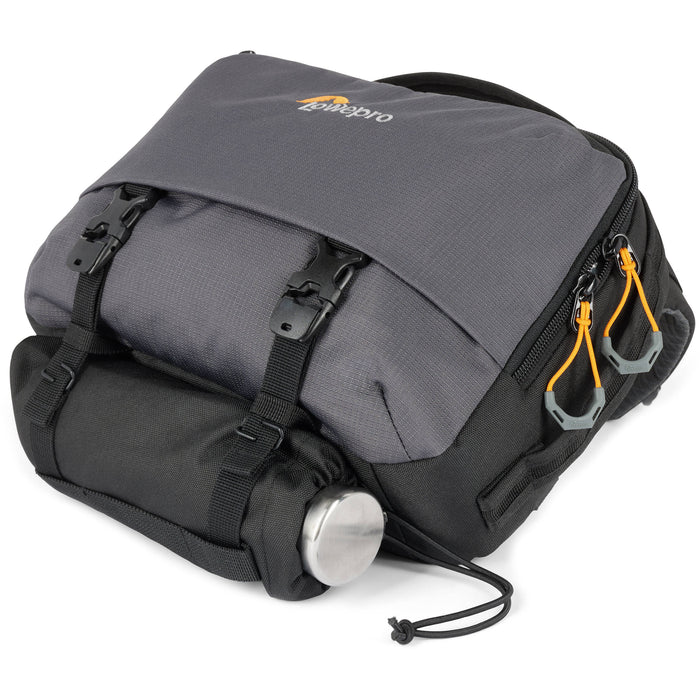 Eco-friendly Lowepro Trekker Lite SLX 120 camera bag with padded compartments and accessories