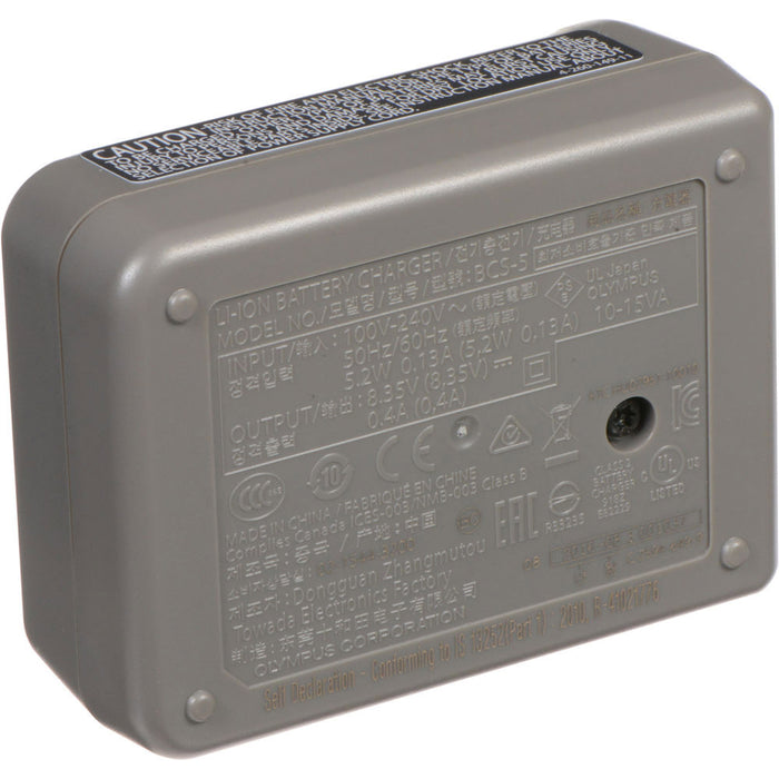 Olympus BCS-5 dedicated lithium-ion battery charger for BLS-5 and BLS-50 batteries, compatible with 100-240V AC international power supplies.