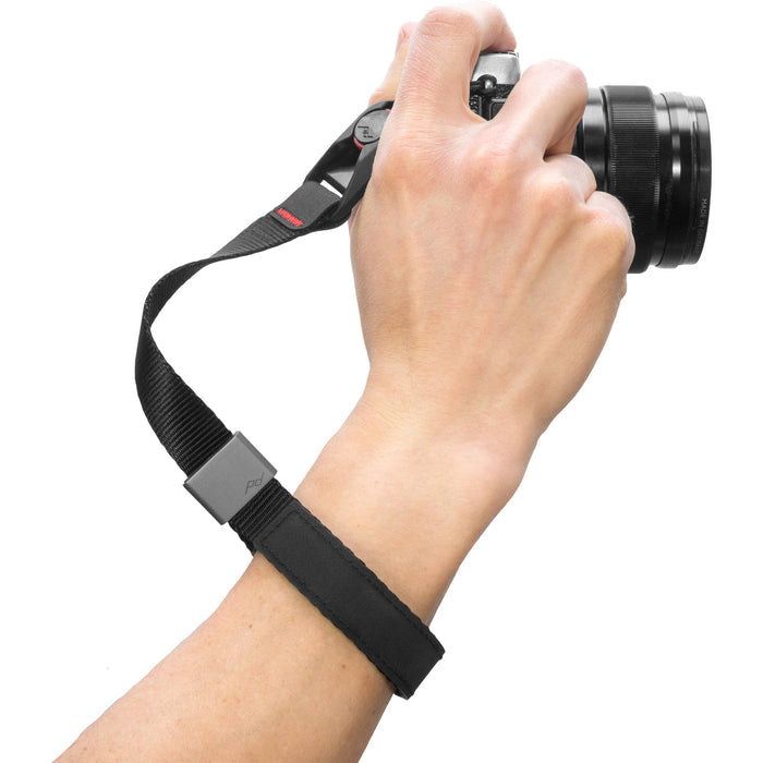The wrist strap conveniently secures your camera or a pair of binoculars to an adjustable wrist strap.