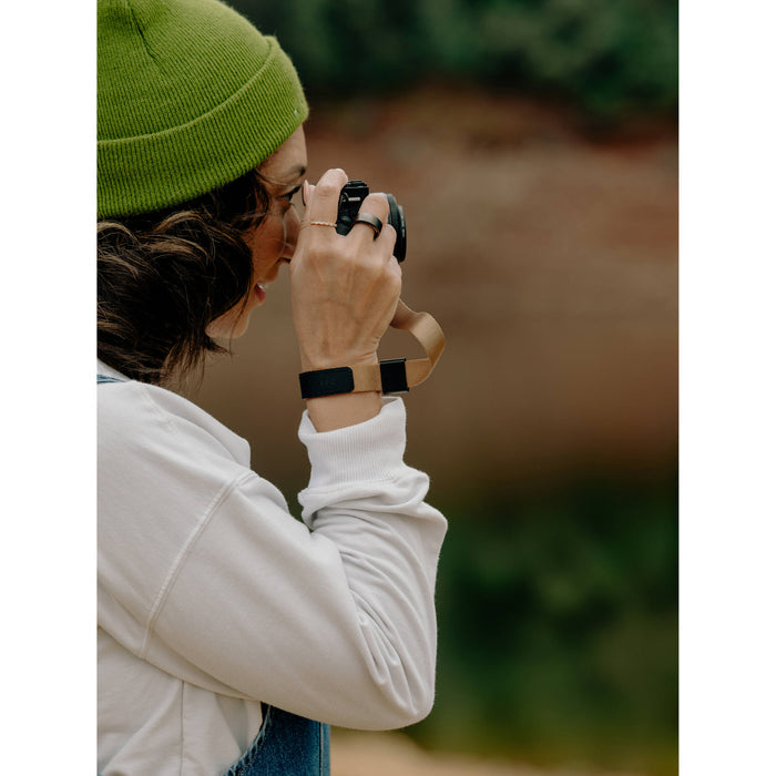 The Peak Design Cuff is a sleek, ultra-secure wrist strap with Dyneema-corded Anchors, holding over 90kg, perfect for protecting heavy cameras.
