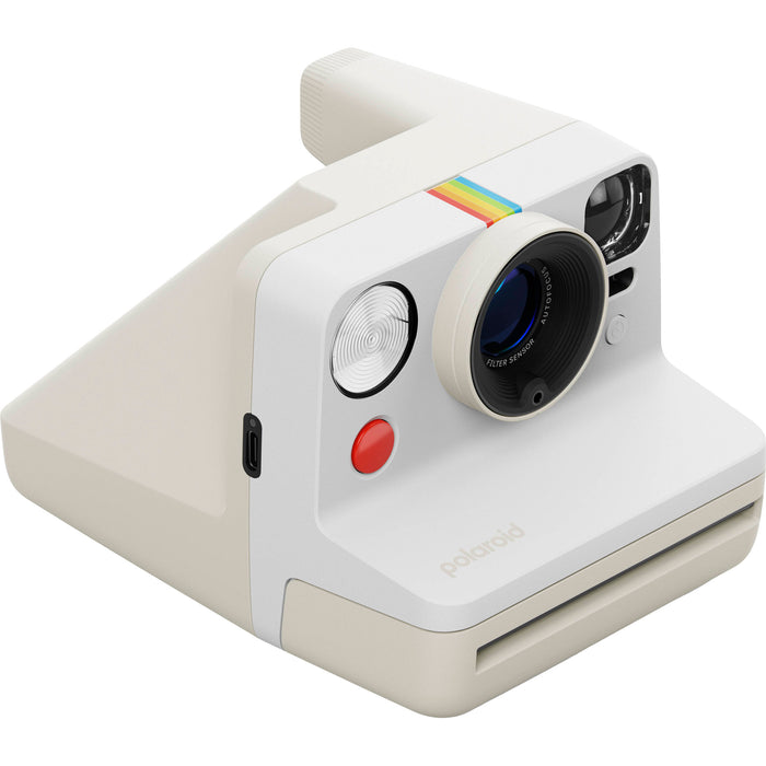 Polaroid Now Generation 3 Starter Set in white featuring upgraded two-lens autofocus, double exposure and self-timer modes, built-in tripod mount, USB-C rechargeable battery, made with 40% recycled plastics, compatible with Polaroid i-Type and 600 film.