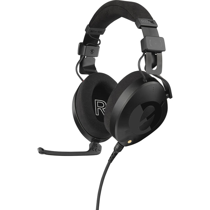 Black over-ear professional headset with adjustable boom microphone, detachable straight cable, and closed-back design.