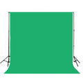 Green 3x6 meter muslin photography backdrop designed for chroma keying and studio portraits, with durable heavy cotton material and sewn edges.