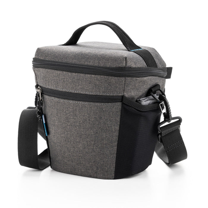 Gray and black camera bag with a shoulder strap on a white background