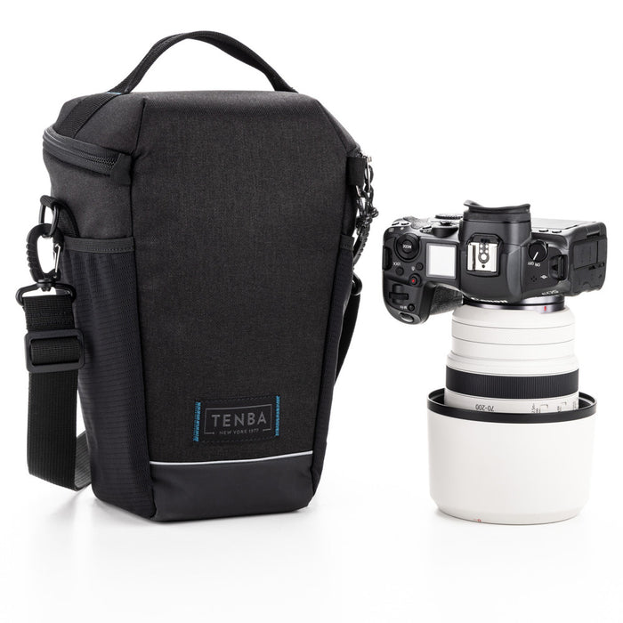 Black camera bag with a camera and lens on a white background