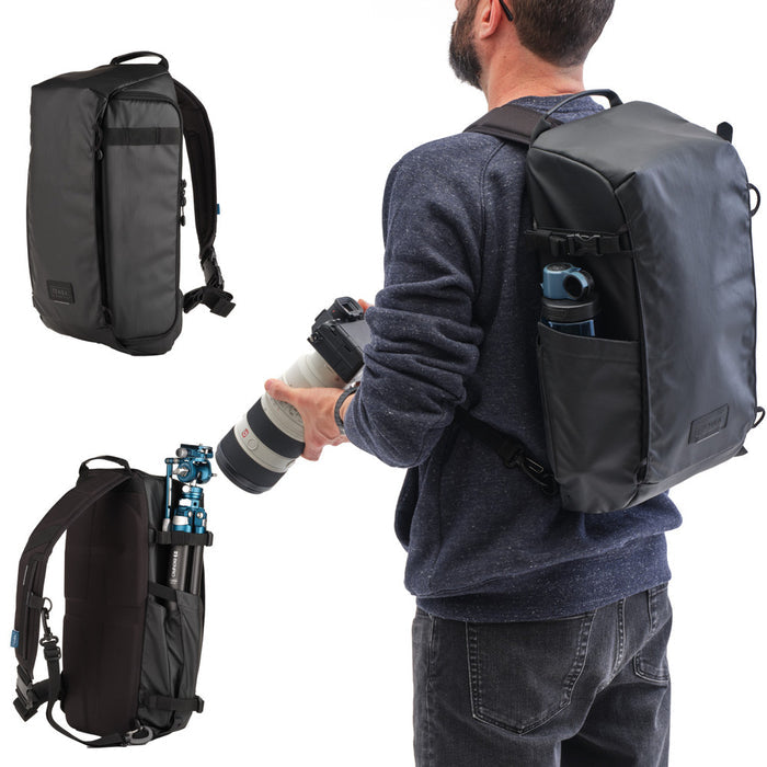 Man holding a camera with a backpack on a white background