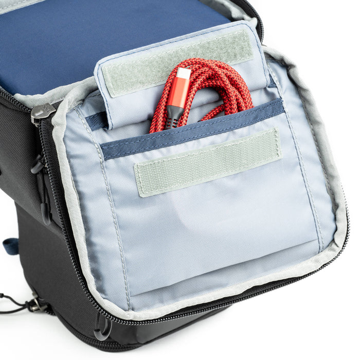 Think Tank Digital Holster 20 V3 for mirrorless cameras, quick-access, water-resistant, with shoulder strap.