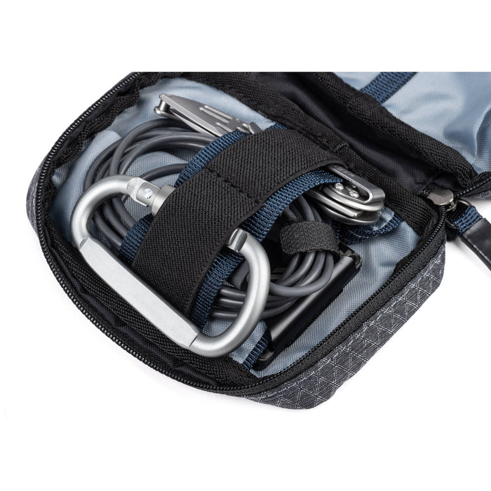 Think Tank EDC Pouch with pockets, zippered compartment, water-repellent coating, and open-flat design for easy access.