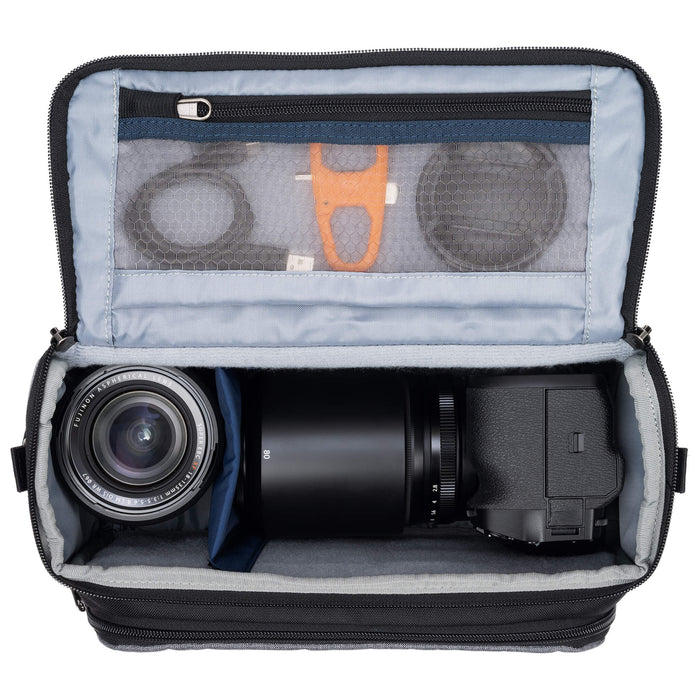 Think Tank Photo Mirrorless Mover 25 camera shoulder bag, black, compact with flip-top lid, multiple pockets, padded interior for mirrorless camera and lenses, rain cover included