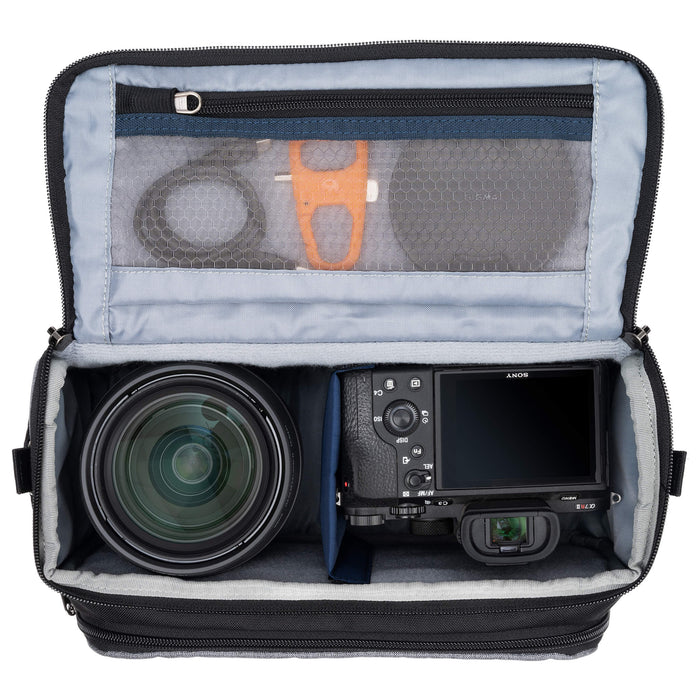 Think Tank Photo Mirrorless Mover 25 camera shoulder bag, black, compact with flip-top lid, multiple pockets, padded interior for mirrorless camera and lenses, rain cover included