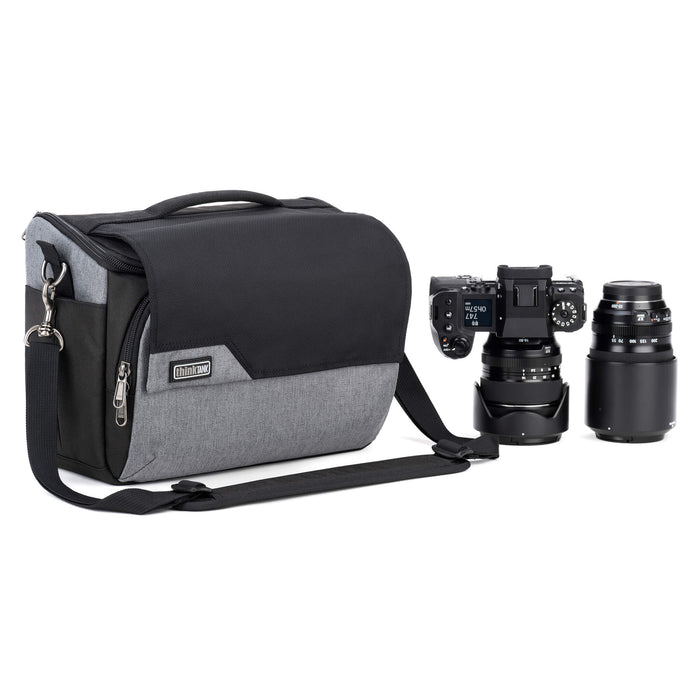 Think Tank Photo Mirrorless Mover 30 camera shoulder bag, flip-top lid with magnetic closure, multiple pockets, padded interior with adjustable dividers for mirrorless camera and lenses, rain cover included