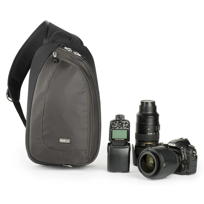 Think Tank TurnStyle 20 V2 sling bag — charcoal camera bag with contoured shoulder strap and side-rotation access for gear