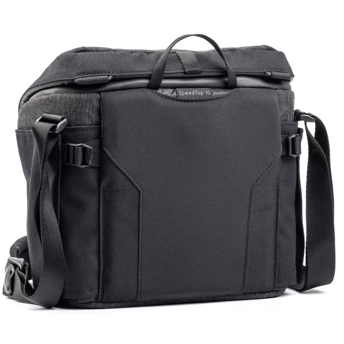 Think Tank SpeedTop 10 — compact crossbody camera bag with magnetic top lid and adjustable strap.