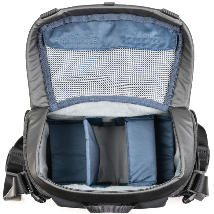Think Tank SpeedTop 10 — compact crossbody camera bag with magnetic top lid and adjustable strap.