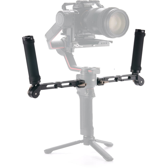 Camera stabilizer with a camera mounted on it against a white background