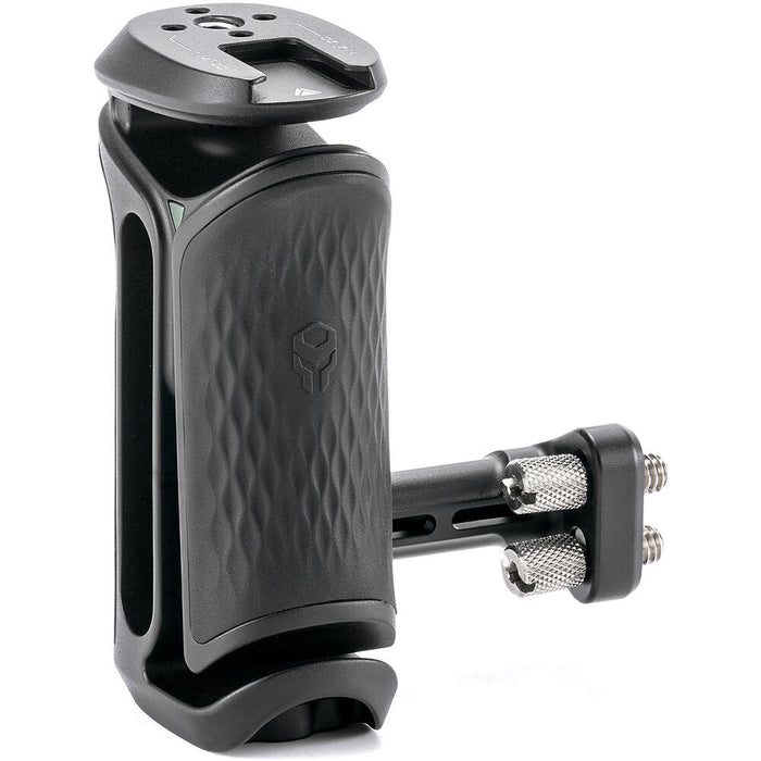 Tilta Xeno Side Handle with dual 1/4"-20 screw mount in black, featuring an ergonomic non-slip silicone grip and a cold shoe receiver for camera cage mounting.