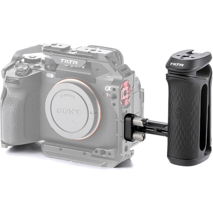 Tilta Xeno Side Handle with dual 1/4"-20 screw mount in black, featuring an ergonomic non-slip silicone grip and a cold shoe receiver for camera cage mounting.