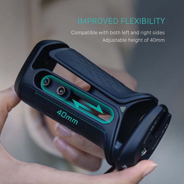 Tilta Xeno Side Handle with dual 1/4"-20 screw mount in black, featuring an ergonomic non-slip silicone grip and a cold shoe receiver for camera cage mounting.